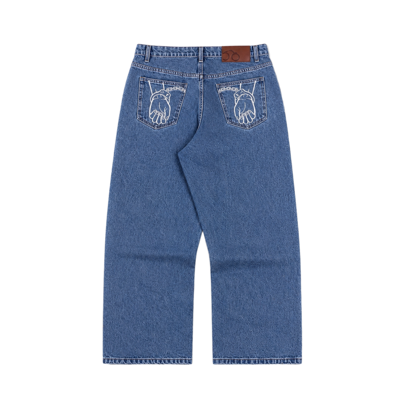 CROOKSLDN blue wash 14oz denim jeans with straight cut, mid rise, and white embroidered hand graphic on back pockets.