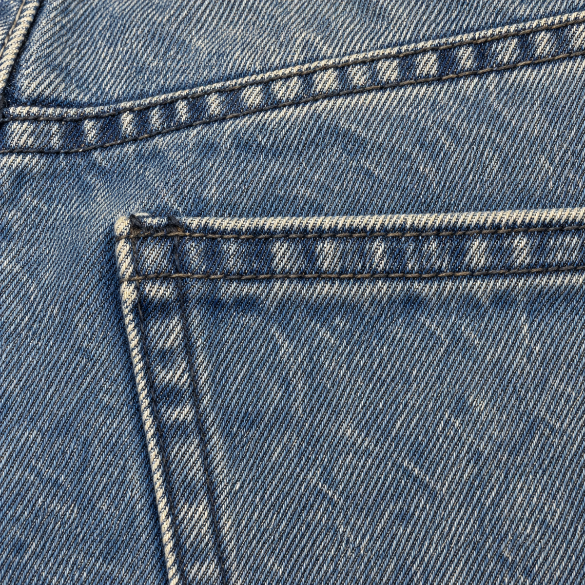 CROOKSLDN Blue Wash Yard Jeans — close fabric and wash detail showing denim grain, seams and stitching.